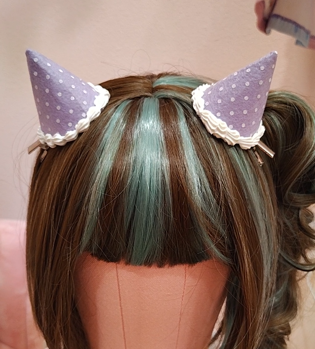 Purple devil horn hair accessory with white polkadots and decoden cream