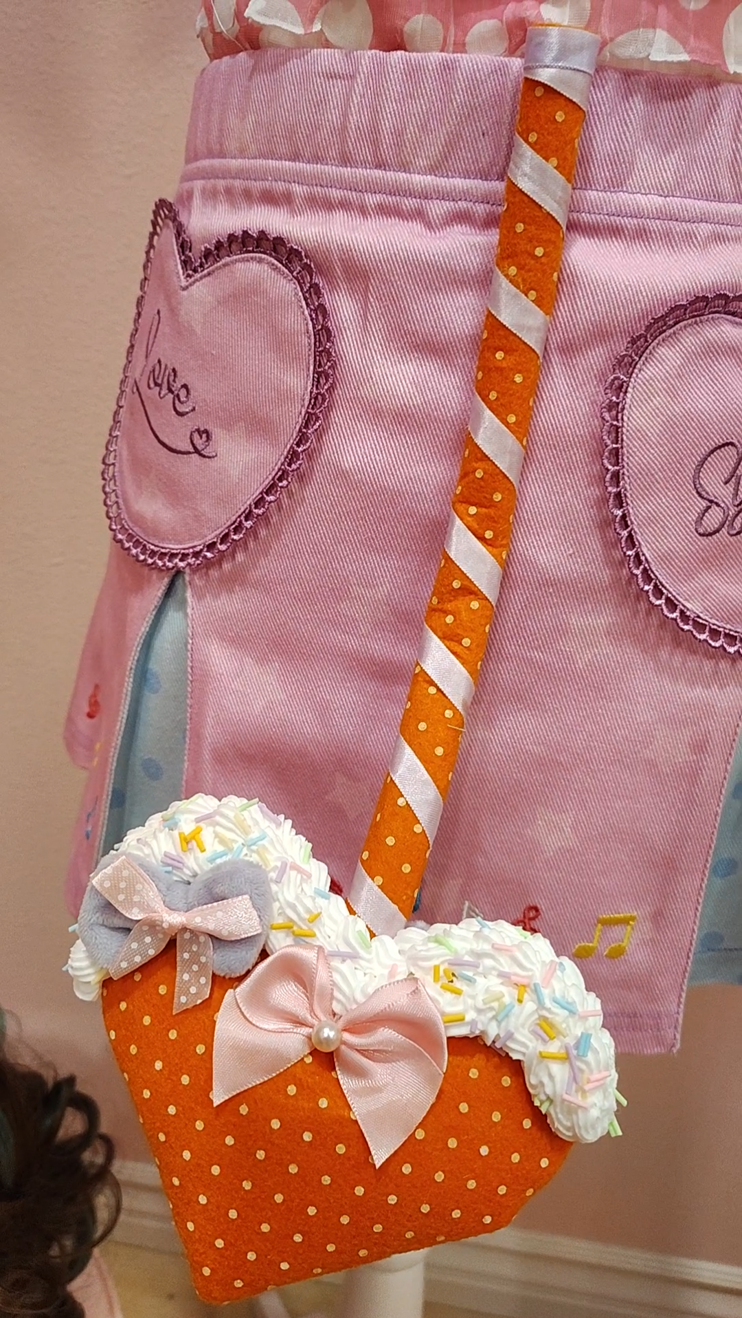 Orange devil tail accessory with polkadots, ribbon, heart tip, and decoden cream with sprinkles
