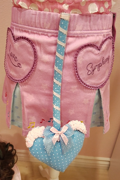 Blue devil tail accessory with white polkadots, silver ribbon, and decoden cream