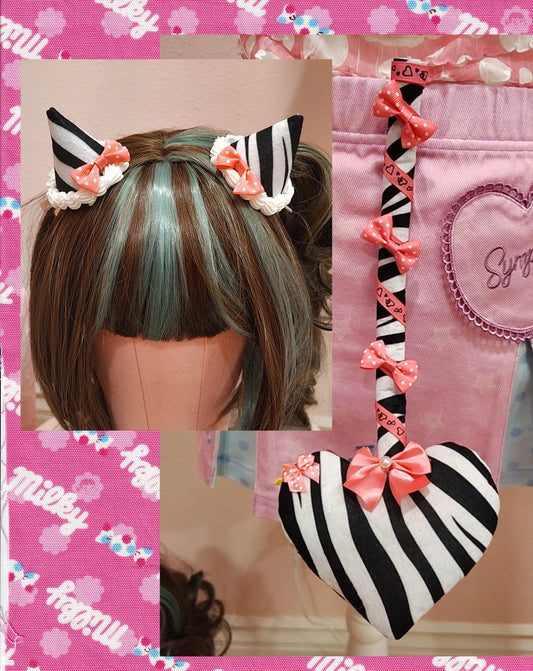 Collage of zebra patterned devil tail accessory with pink ribbons and bows, with a heart tip, and matching devil horn hair clips.
